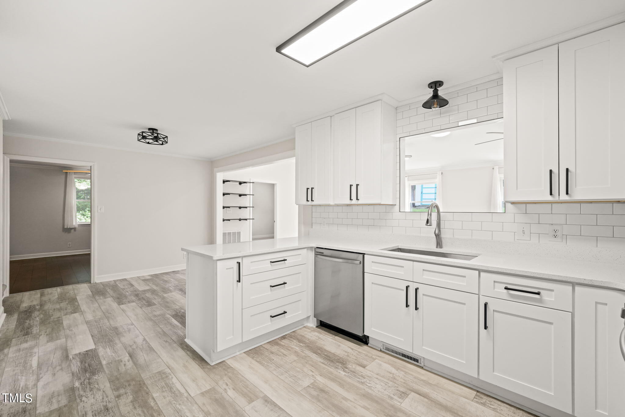 2835 Fox Drive Durham, NC 27712 - Photo 7 of 53 a kitchen with white cabinets and sink