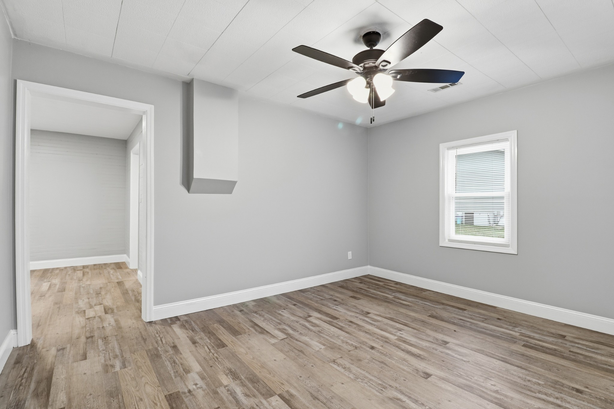 612 Maple Street Manchester, TN 37355 - Photo 6 of 20 wooden floor in an empty room with a window