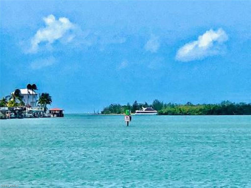 410 Cristobal Street Naples, FL 34113 - Photo 12 of 50 a view of a green field