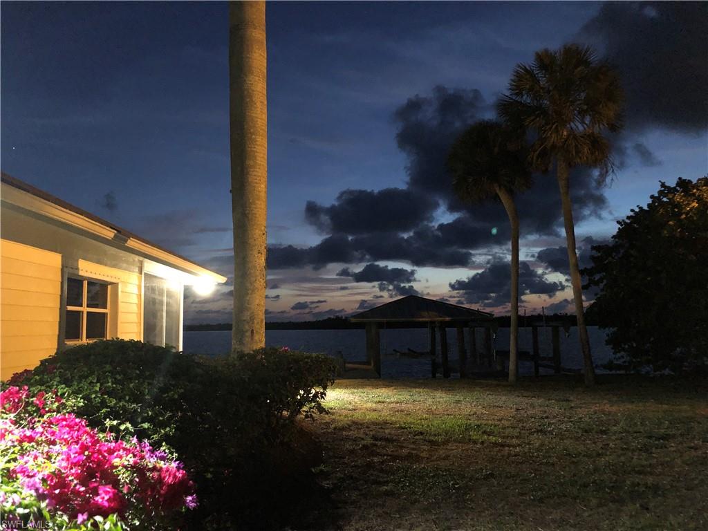 410 Cristobal Street Naples, FL 34113 - Photo 17 of 50 a view of a backyard with plants and a fountain