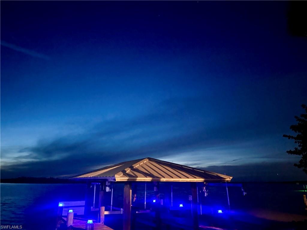 410 Cristobal Street Naples, FL 34113 - Photo 2 of 50 a front view of a house with a yard