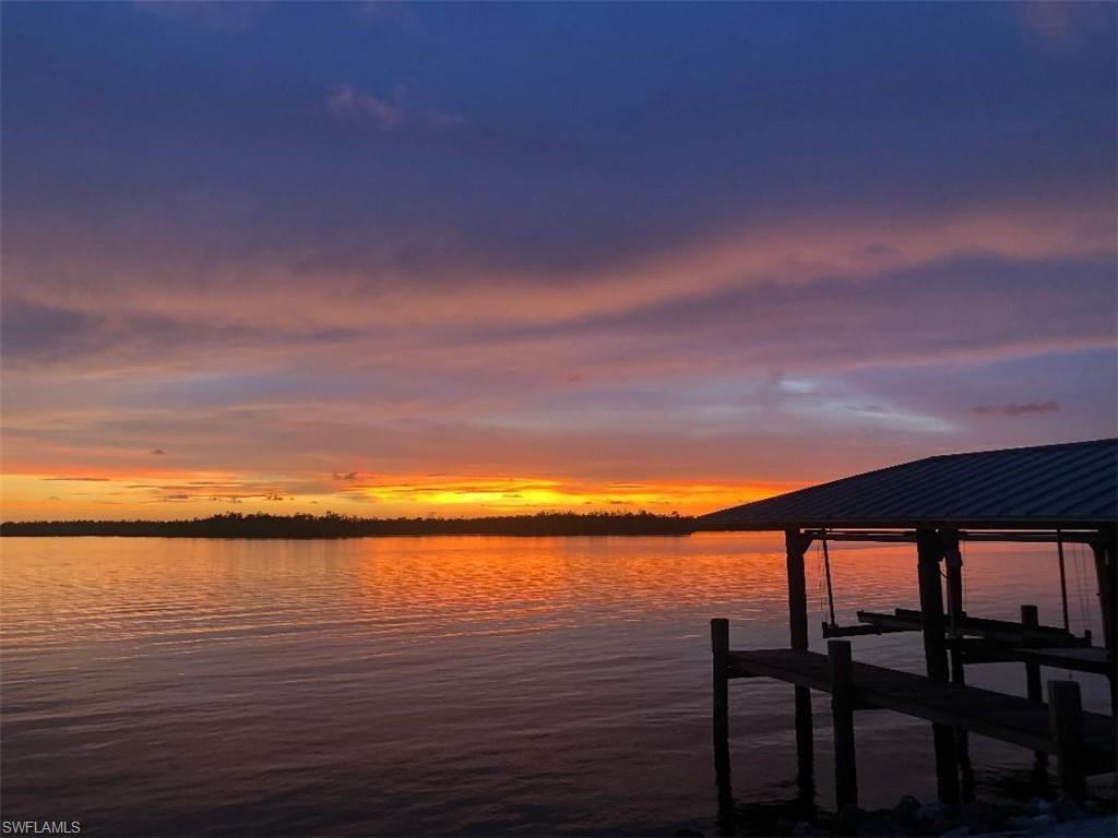 410 Cristobal Street Naples, FL 34113 - Photo 23 of 50 a view of lake from a balcony