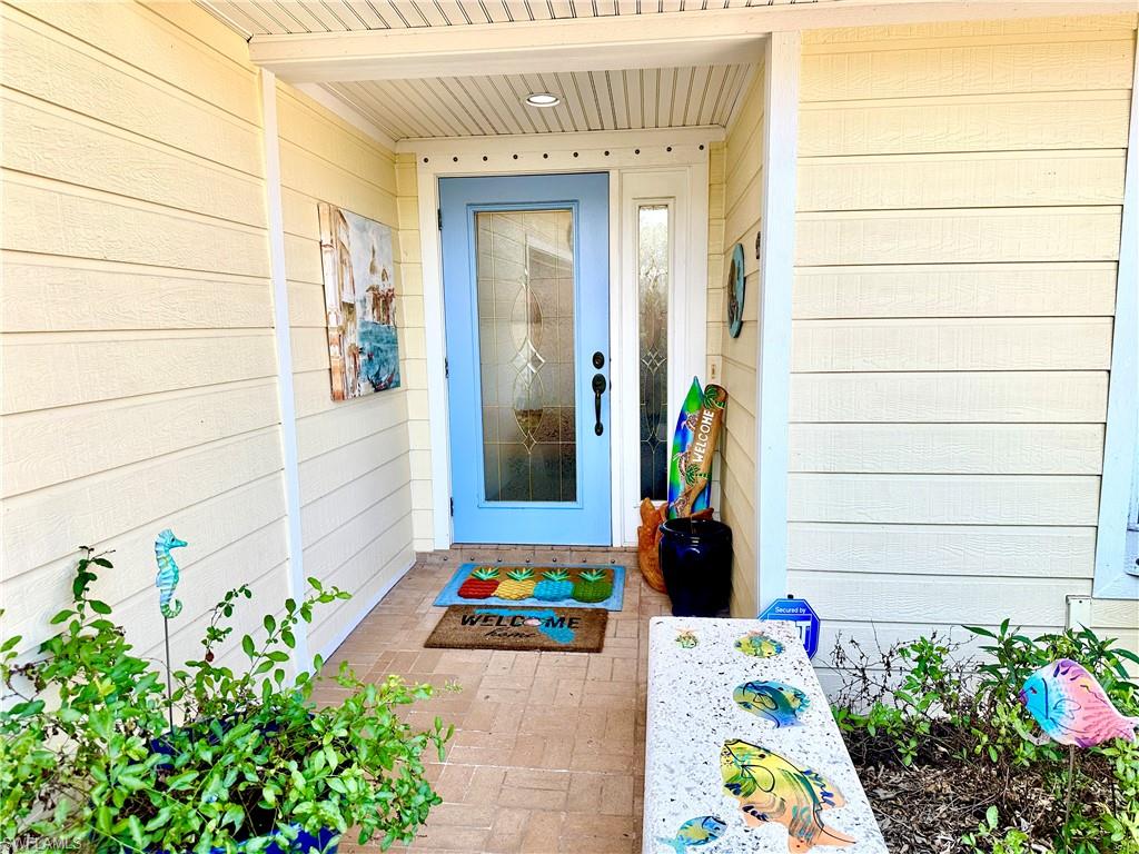 410 Cristobal Street Naples, FL 34113 - Photo 3 of 50 a front view of a house