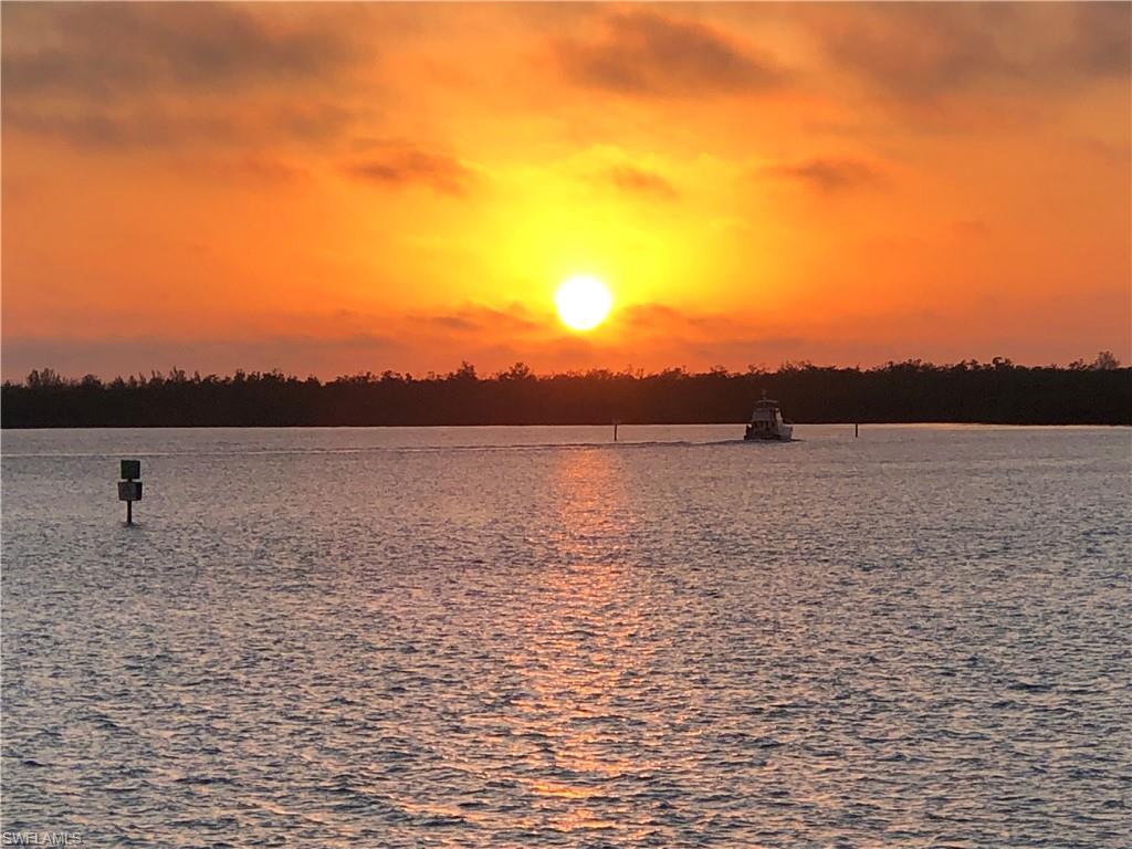 410 Cristobal Street Naples, FL 34113 - Photo 40 of 50 a view of a lake view