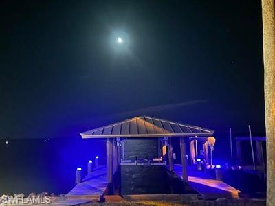 410 Cristobal Street Naples, FL 34113 - Photo 42 of 50 a front view of a house with yard