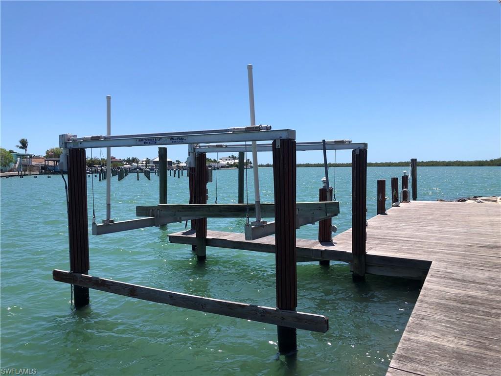 410 Cristobal Street Naples, FL 34113 - Photo 7 of 50 a view of a swimming pool with a deck