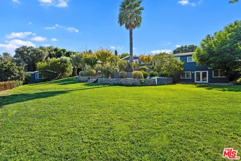 a view of a house with a big yard