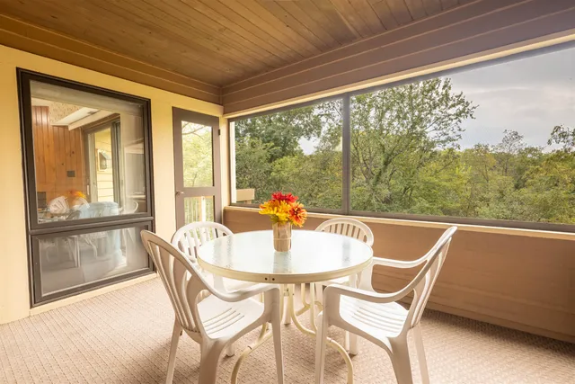 a dining room with furniture and windows
