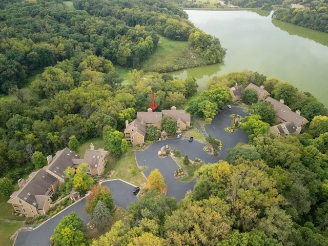 an aerial view of residential houses with outdoor space