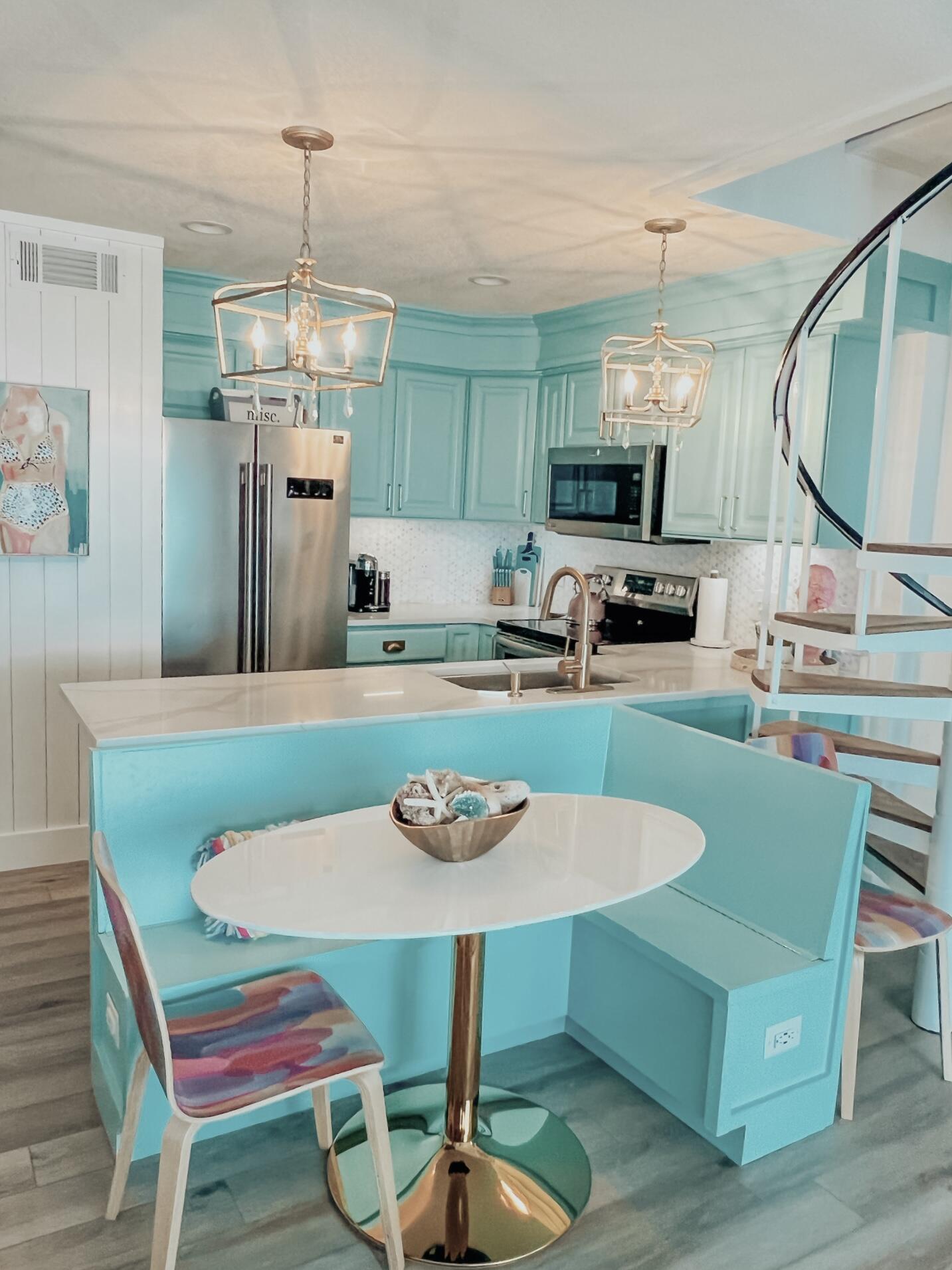 32461 East County Highway 30A, Unit 17 Inlet Beach, FL 32461 - Photo 13 of 53 a view of a dining room with furniture a chandelier and wooden floor