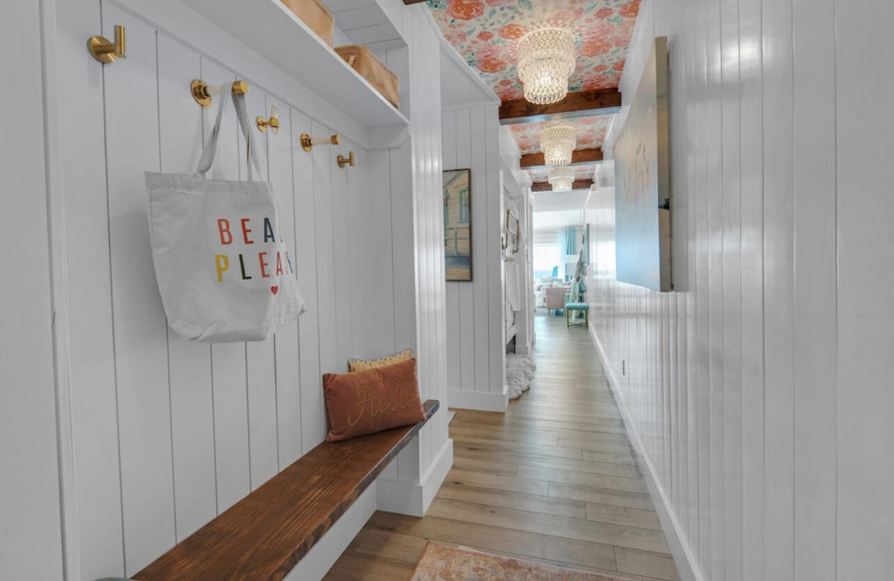 32461 East County Highway 30A, Unit 17 Inlet Beach, FL 32461 - Photo 6 of 53 a hallway with wooden floor and stairs