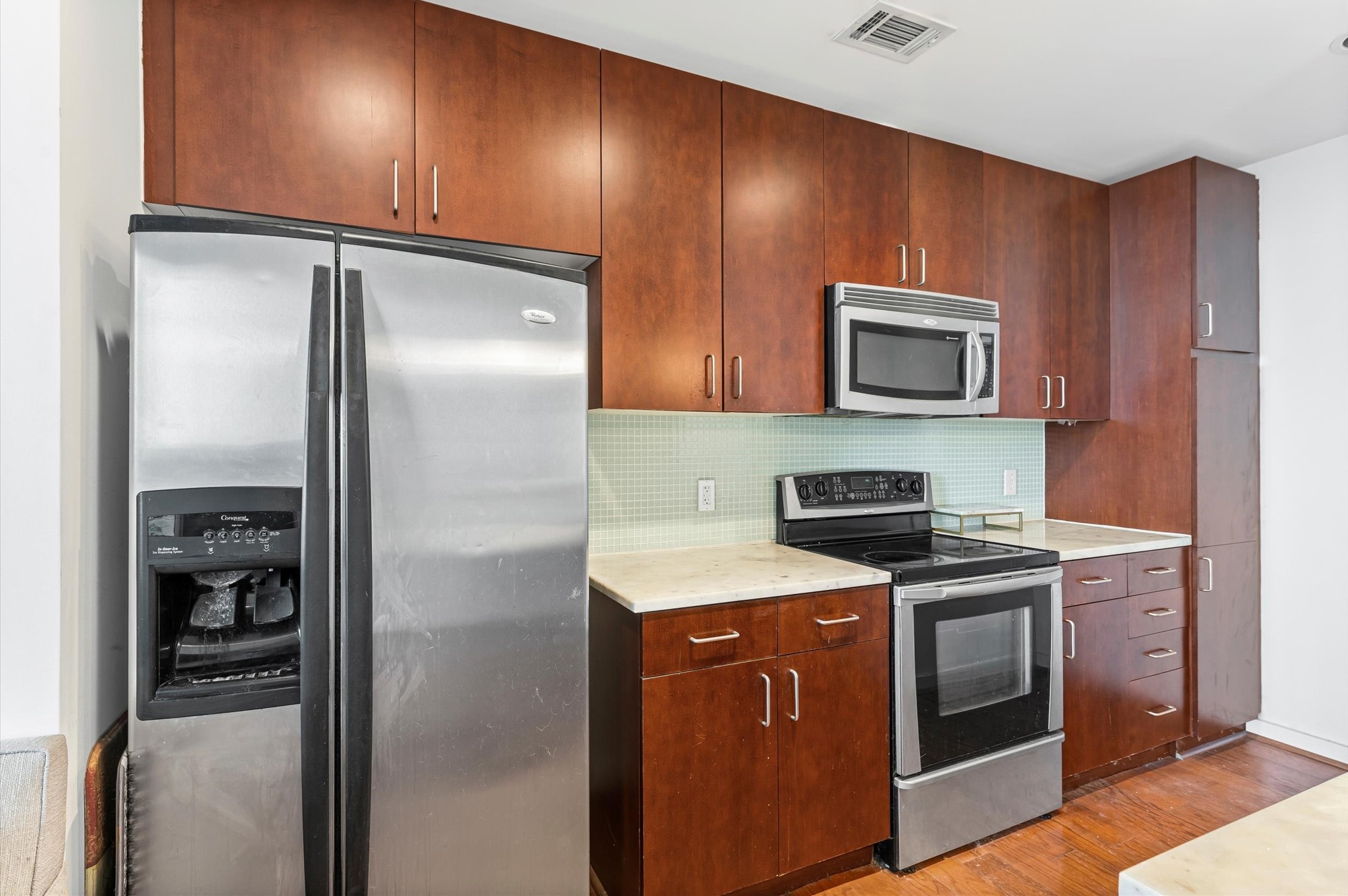 5925 Almeda Road, Unit 11315 Houston, TX 77004 - Photo 8 of 31 a kitchen with stainless steel appliances granite countertop a refrigerator stove and sink