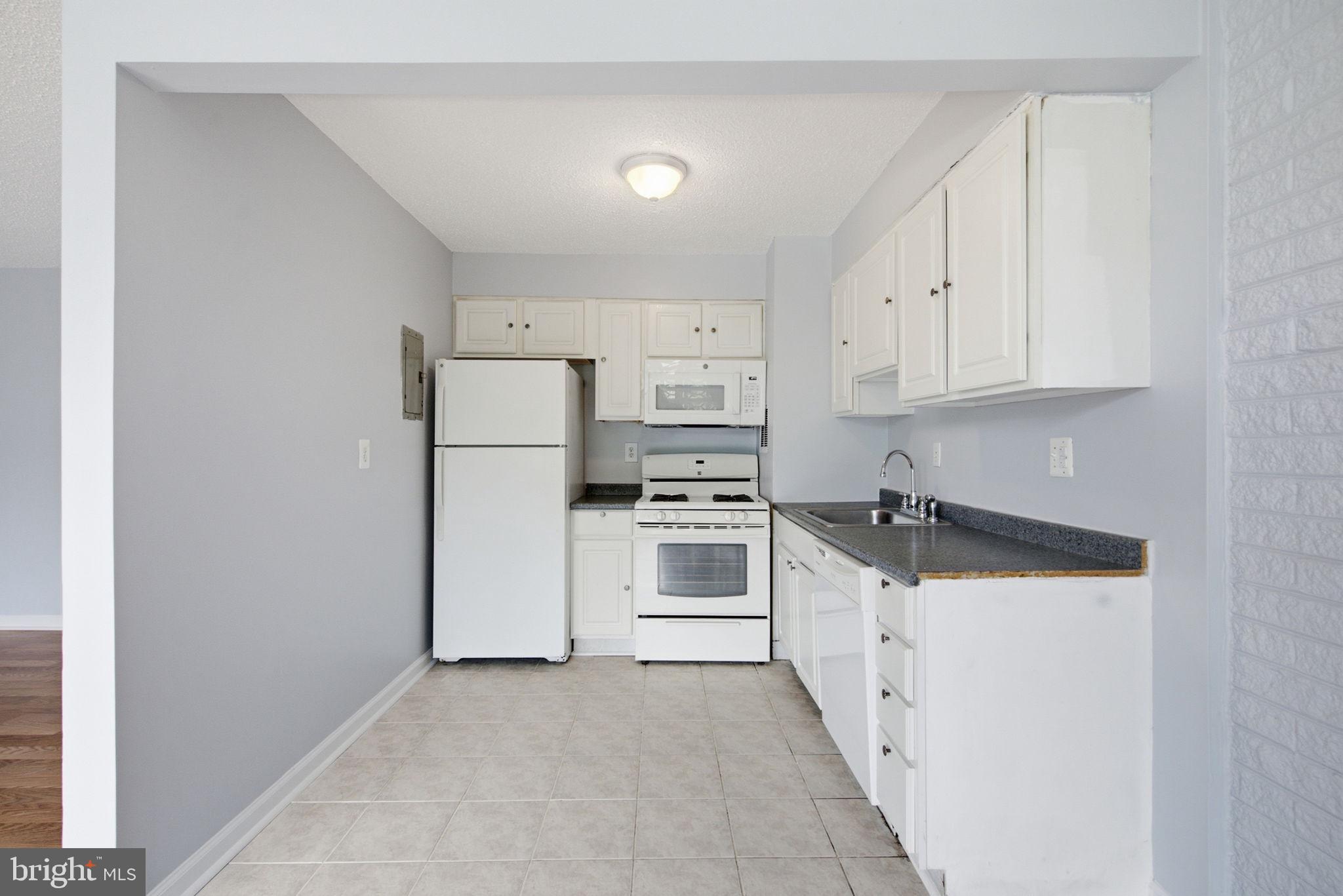 1822 Metzerott Road, Unit 103 Hyattsville, MD 20783 - Photo 9 of 25 Kitchen with tile floor and counter space