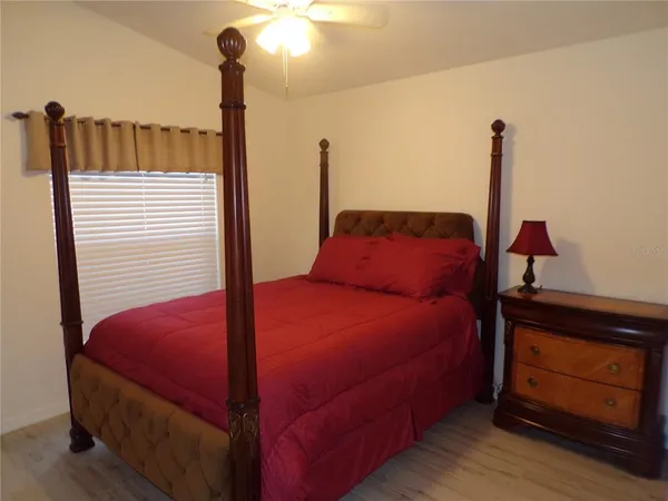 a bedroom with a bed and a dresser