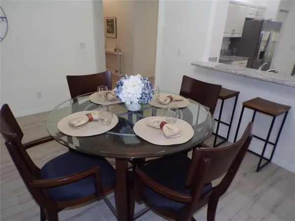 a view of a dining room with furniture and wooden floor