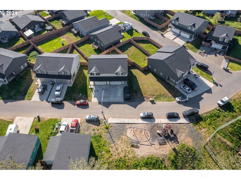 213 Oak Street Winlock, WA 98596 - Photo 4 of 32 an aerial view of a house with a swimming pool