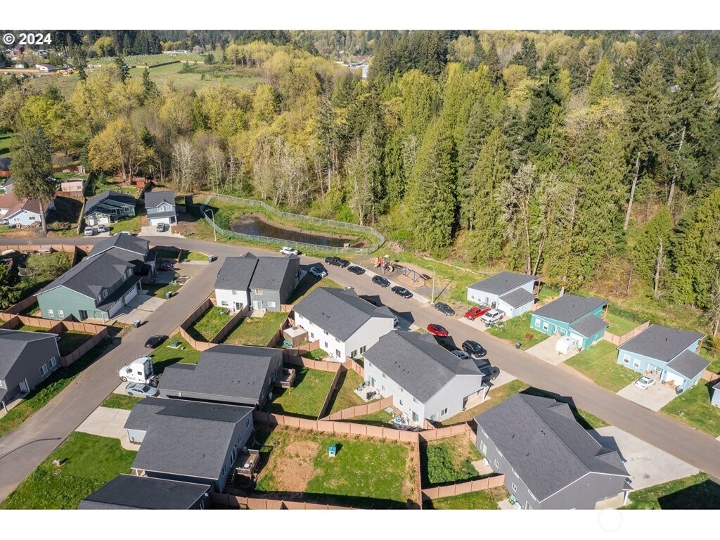 213 Oak Street Winlock, WA 98596 - Photo 9 of 32 an aerial view of residential house with outdoor space and parking