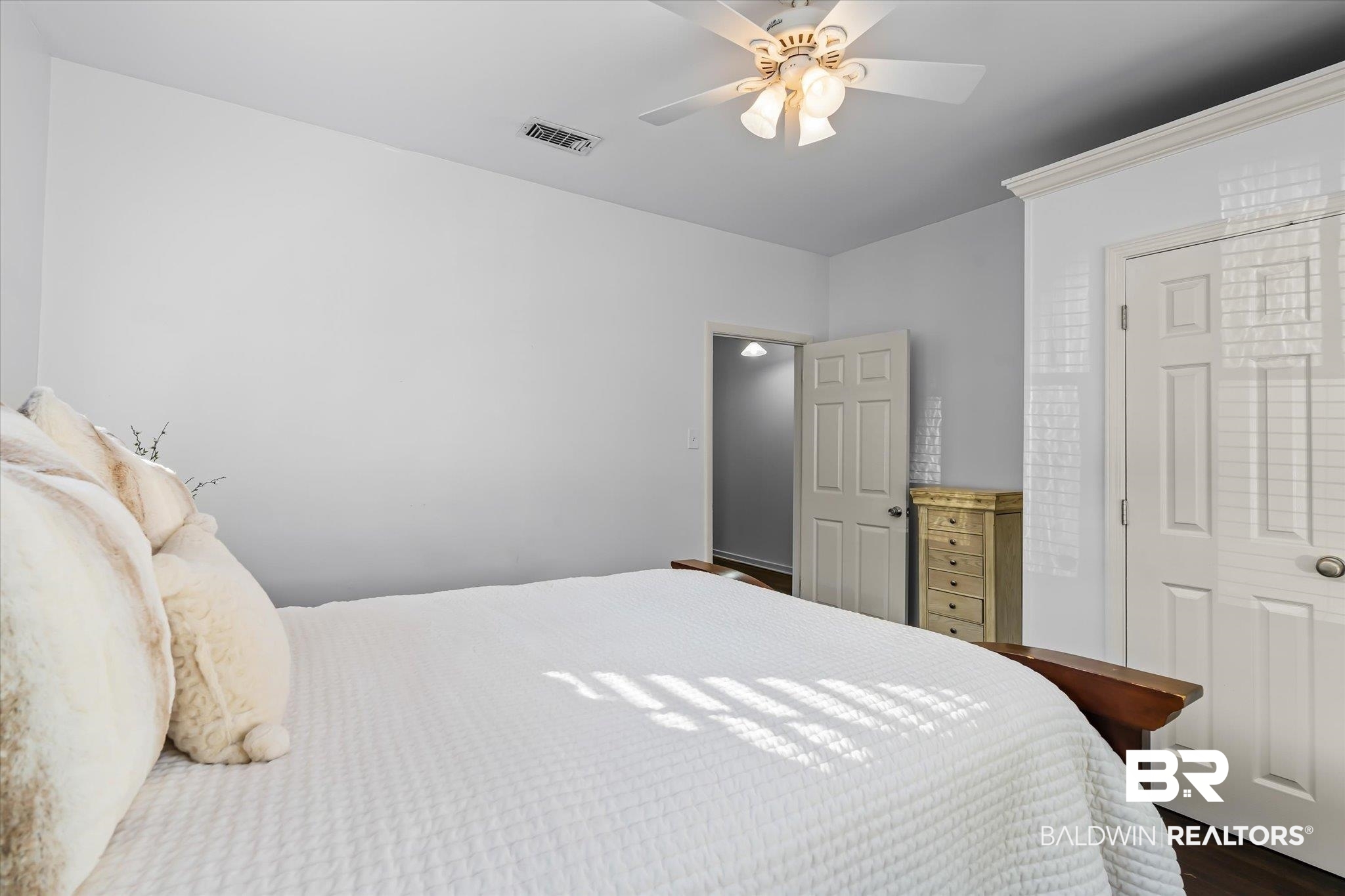 180 Williams Street Mobile, AL 36606 - Photo 15 of 20 Bedroom with ceiling fan and dark wood-type flooring