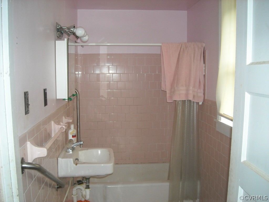 16400 Harrowgate Road Chester, VA 23831 - Photo 5 of 14 a bathroom with a sink mirror and shower