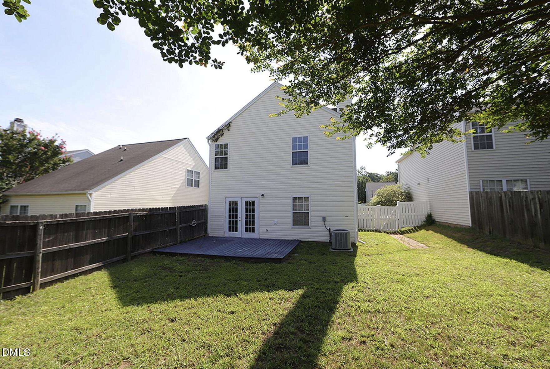9904 Treymore Drive Raleigh, NC 27617 - Photo 13 of 14 a view of house with garden and trees