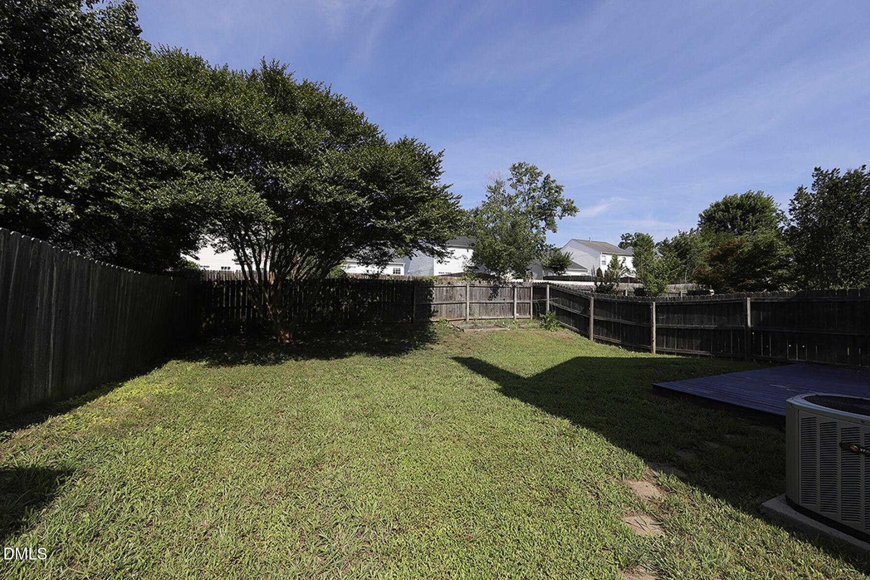 9904 Treymore Drive Raleigh, NC 27617 - Photo 14 of 14 a view of backyard with green space