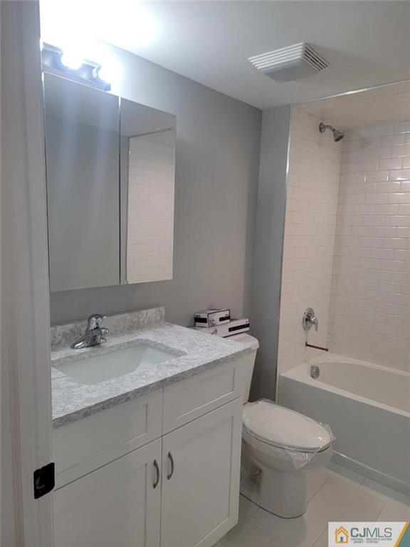 32 Middle Hill Road Colonia, NJ 07067 - Photo 21 of 21 a bathroom with a sink toilet vanity and shower