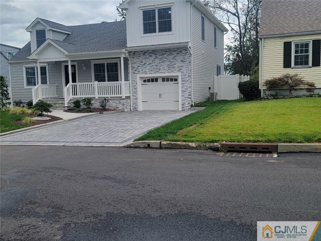 32 Middle Hill Road Colonia, NJ 07067 - Photo 3 of 21 a front view of a house with a garden and yard