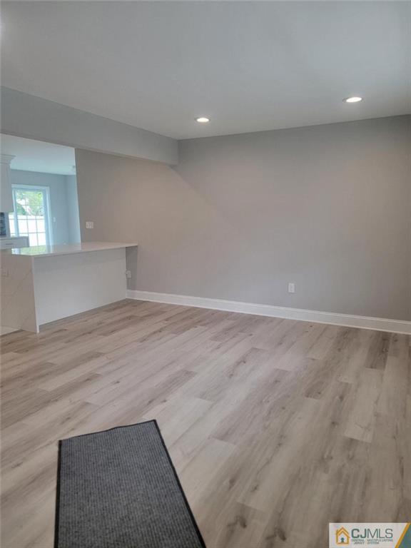 32 Middle Hill Road Colonia, NJ 07067 - Photo 7 of 21 an empty room with wooden floor and windows