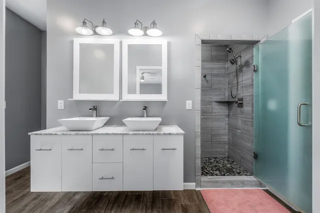 a bathroom with a sink and a mirror