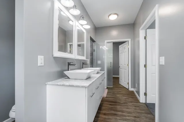 a bathroom with a sink and a mirror