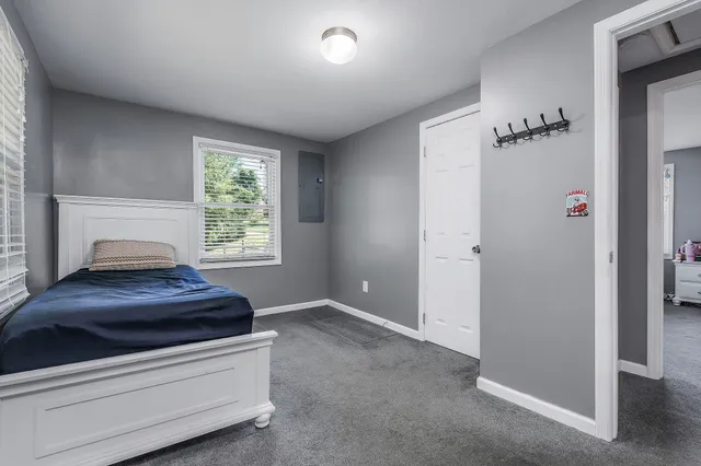 a room with a bed and a window