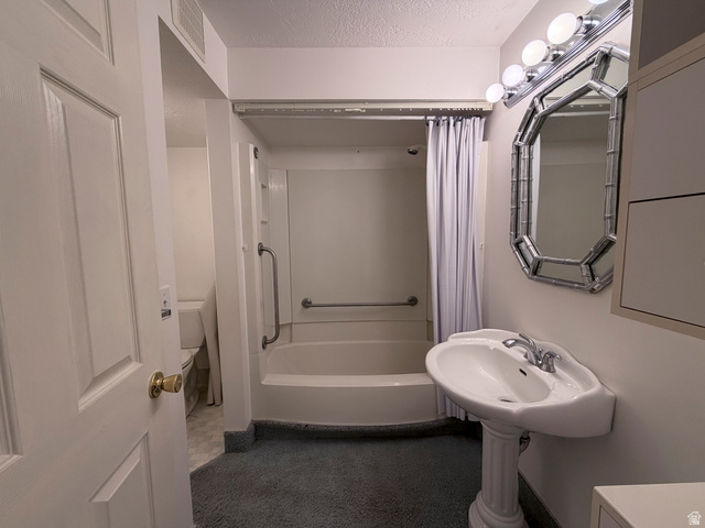 2855 South 1000 West Perry, UT 84302 - Photo 134 of 142 Full bathroom with a textured ceiling and shower / bath combo