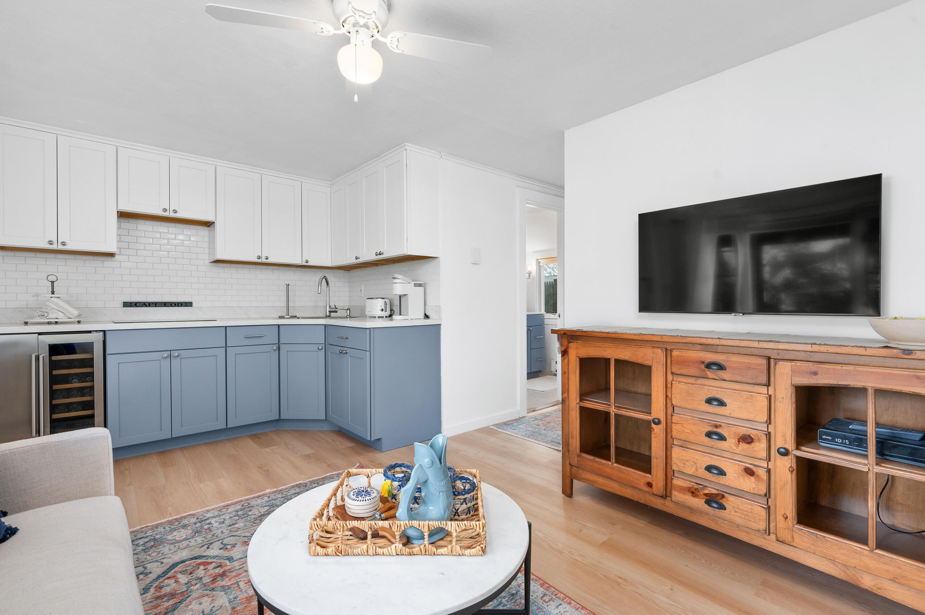405 Lower County Road, Unit 23C Harwich Port, MA 02646 - Photo 1 of 17 a living room with stainless steel appliances kitchen island granite countertop a stove a sink and a microwave