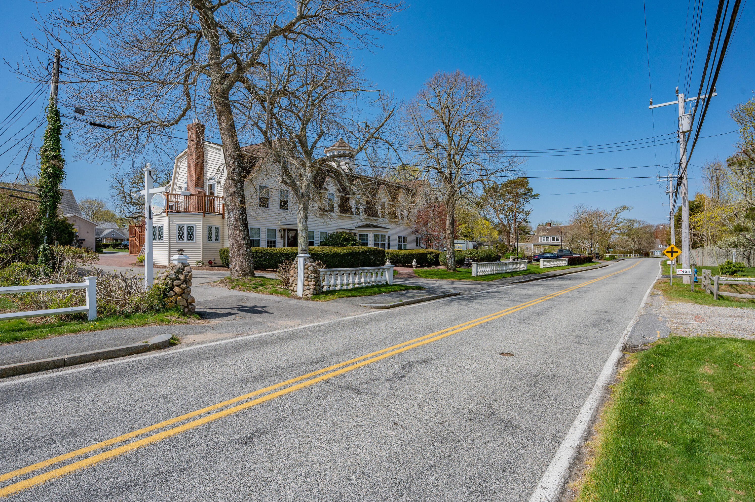 405 Lower County Road, Unit 23C Harwich Port, MA 02646 - Photo 12 of 17 a view of a street with cars parked on the roadside