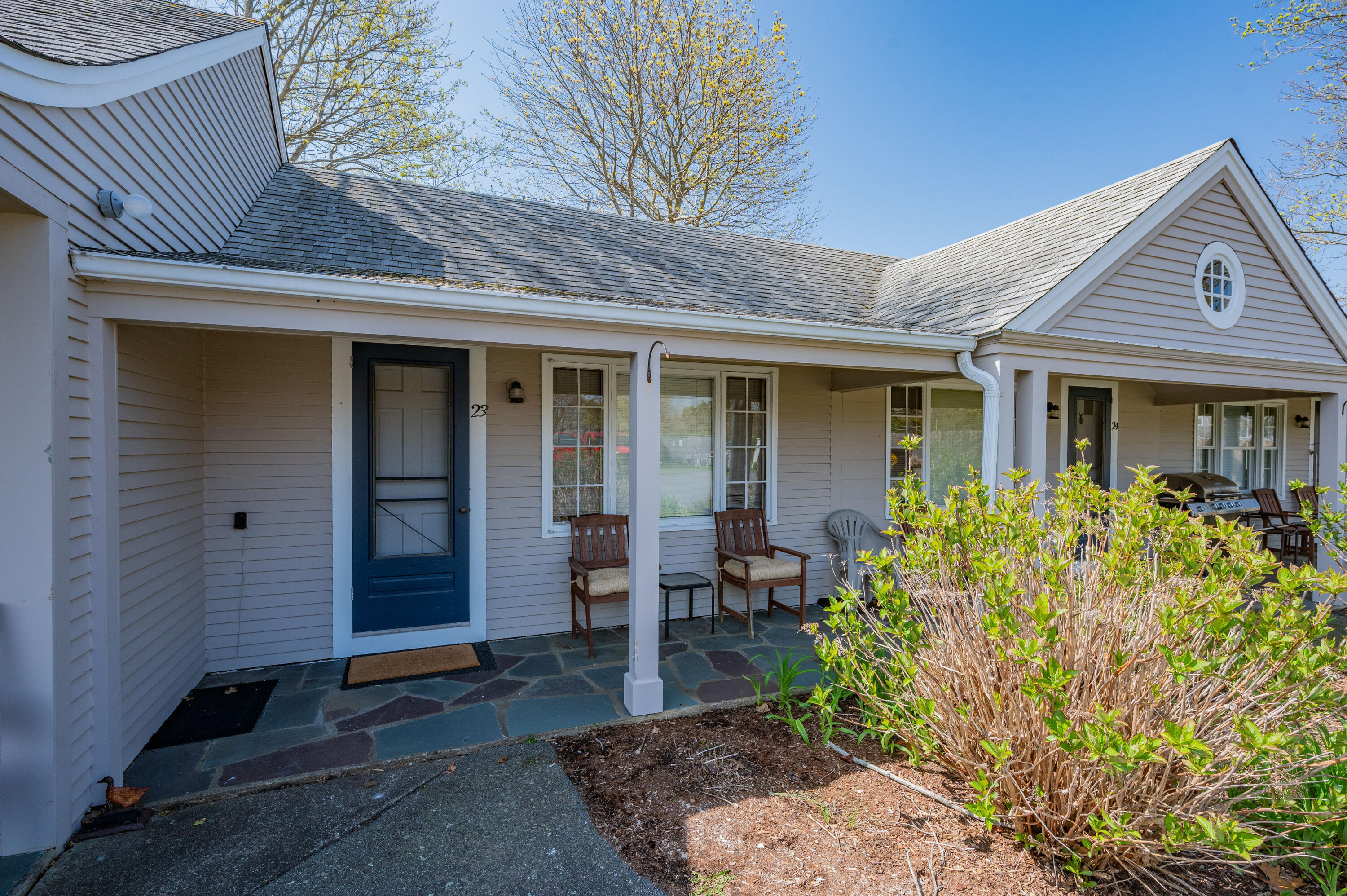 405 Lower County Road, Unit 23C Harwich Port, MA 02646 - Photo 14 of 17 a view of the house with outdoor seating