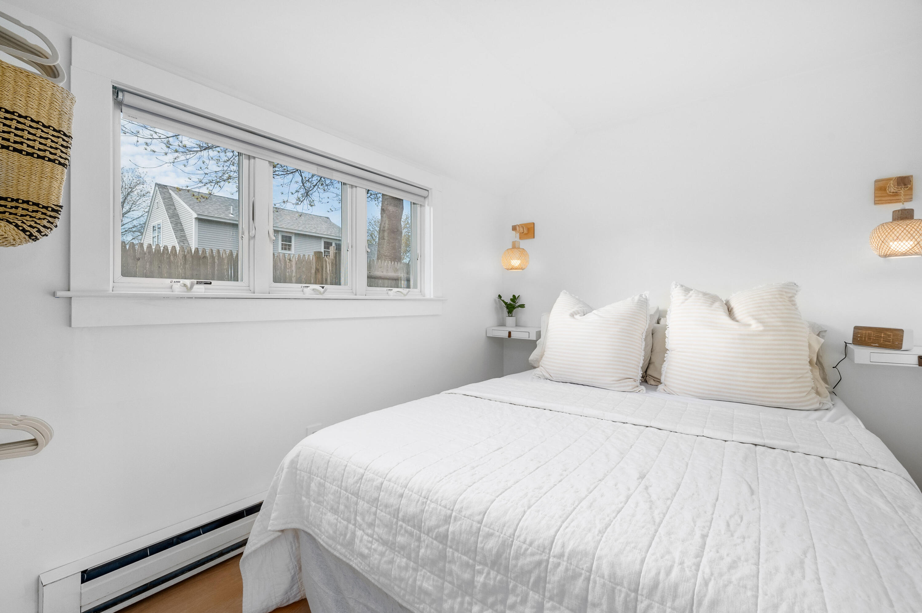 405 Lower County Road, Unit 23C Harwich Port, MA 02646 - Photo 6 of 17 a bedroom with a bed and wooden floor