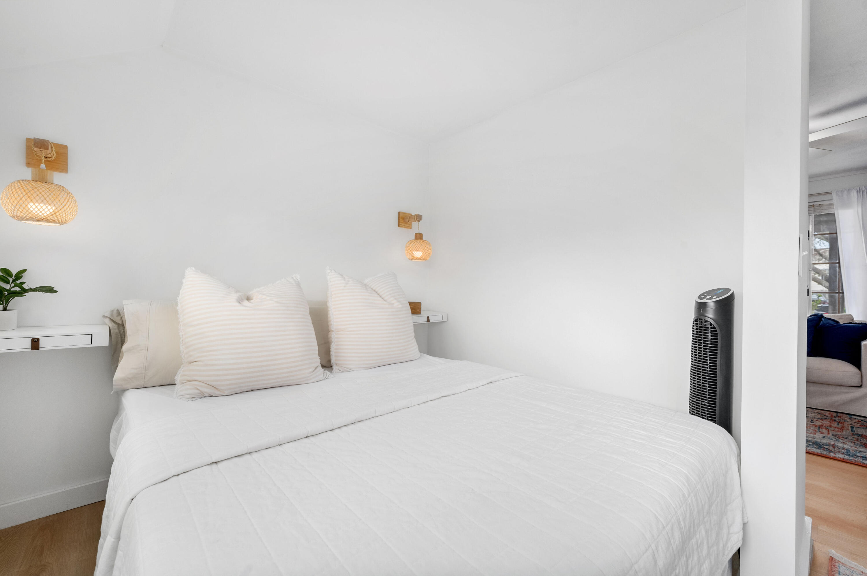 405 Lower County Road, Unit 23C Harwich Port, MA 02646 - Photo 7 of 17 a bedroom with a bed and a potted plant