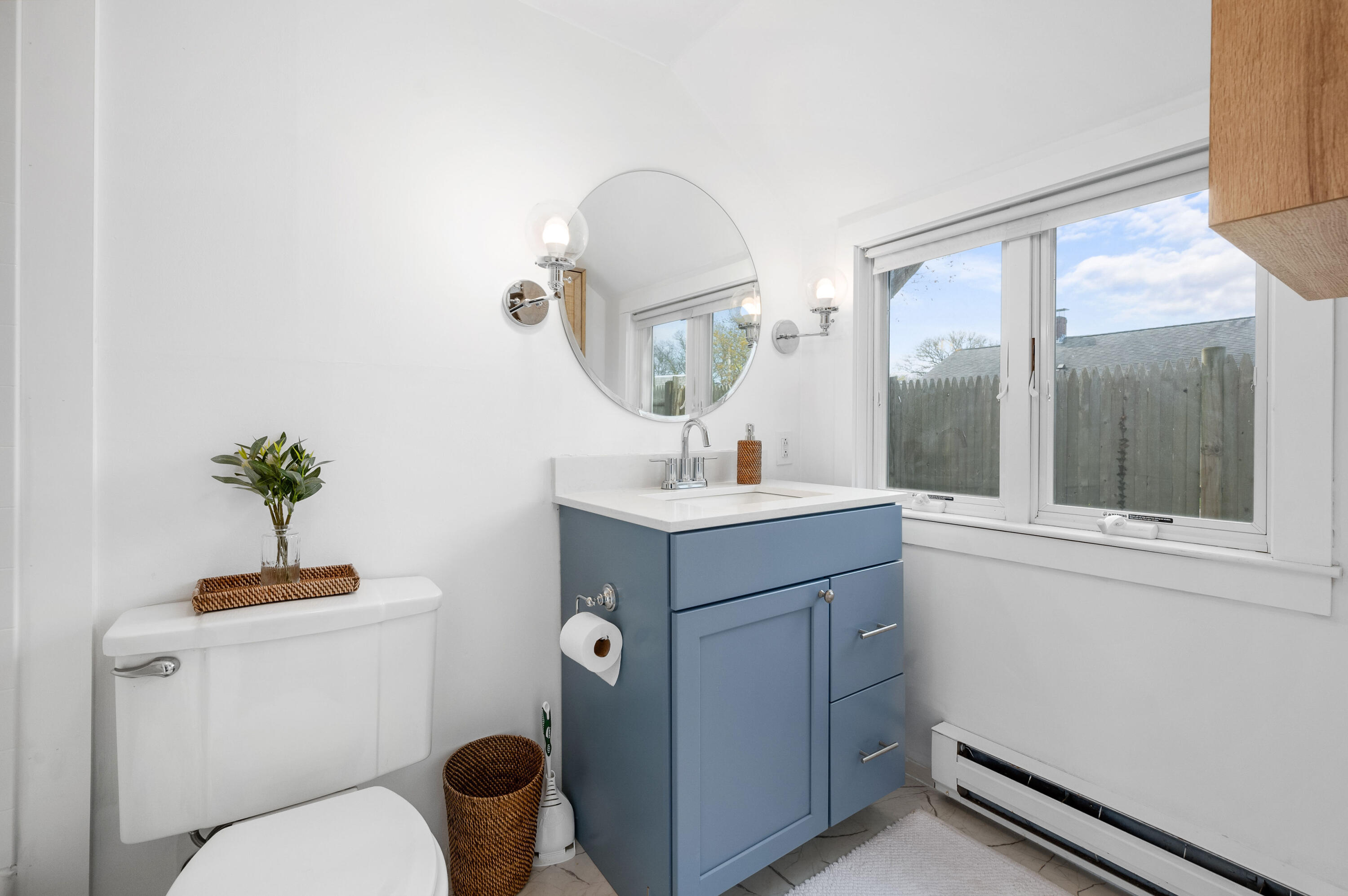 405 Lower County Road, Unit 23C Harwich Port, MA 02646 - Photo 8 of 17 a bathroom with a toilet a sink and mirror