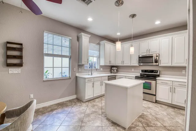 front view of a house with a garden