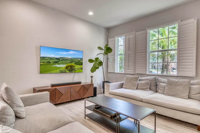 a kitchen with white cabinets stainless steel appliances and sink