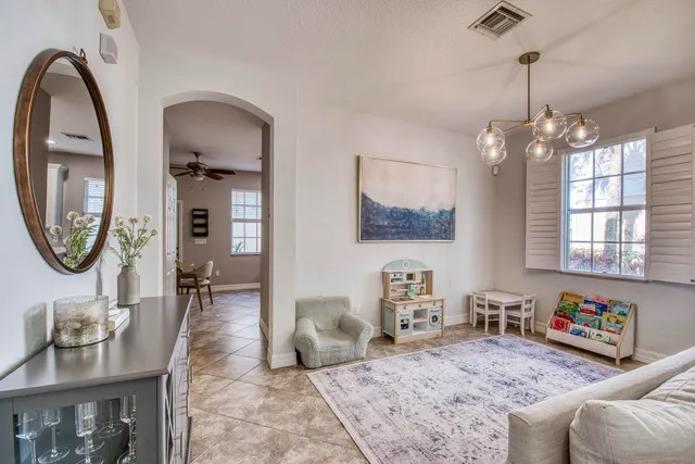 a view of a hallway with wooden floor and closet area