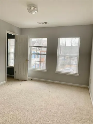 an empty room with windows