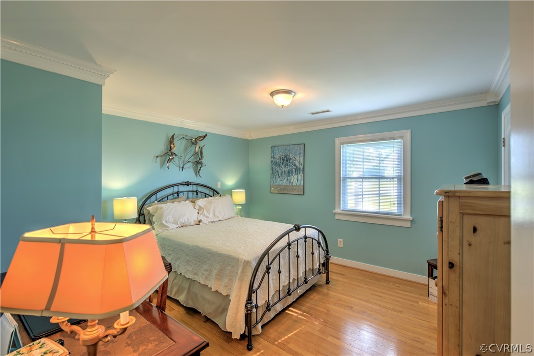 13480 Independence Road Ashland, VA 23005 - Photo 15 of 28 a bedroom with a bed and wooden floor