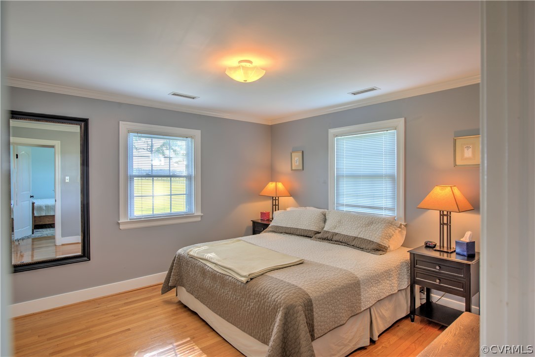 13480 Independence Road Ashland, VA 23005 - Photo 16 of 28 a bedroom with a bed and a lamp next to a window