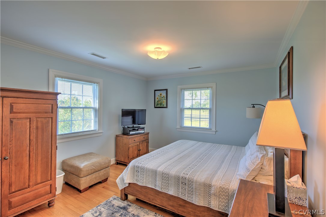 13480 Independence Road Ashland, VA 23005 - Photo 18 of 28 a bedroom with a bed and wooden floor