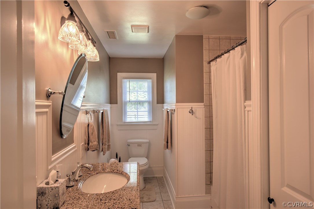 13480 Independence Road Ashland, VA 23005 - Photo 19 of 28 a bathroom with a sink a toilet and a mirror