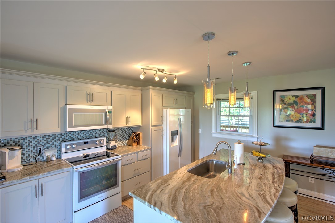 13480 Independence Road Ashland, VA 23005 - Photo 10 of 28 a kitchen with a refrigerator and a stove top oven