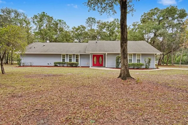 a house with trees in the background