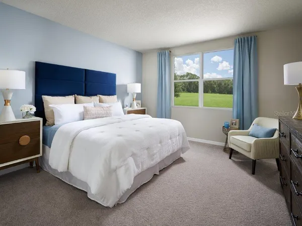 a bed room with a bed and a window