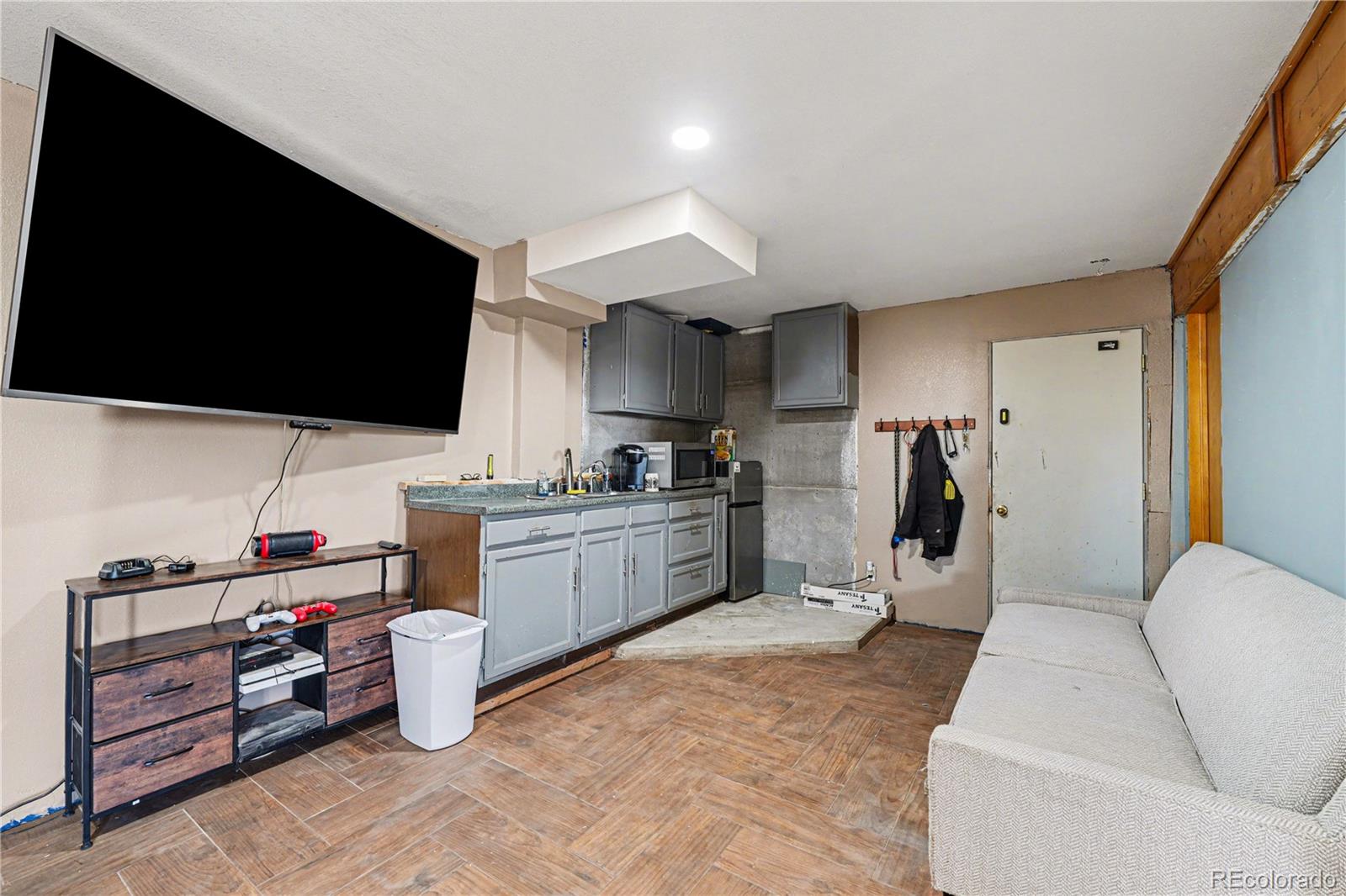 319 Springmeadow Way Red Feather Lakes, CO 80545 - Photo 13 of 30 a living room with furniture and a flat screen tv